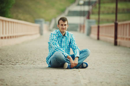 photo of young man on the streetの写真素材