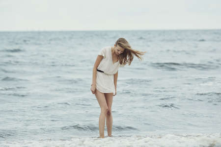 beautiful sensual girl in cold water portraitの写真素材