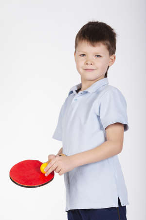 photo of boy playing table tennis on whiteの写真素材