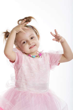 little beautiful girl posing on white backgroundの写真素材