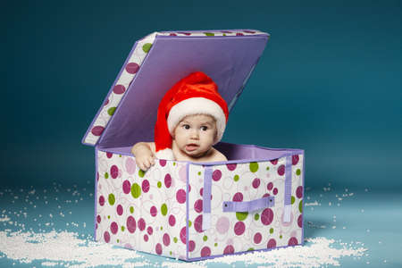 little boy in diapers with hat of Santa Clausの写真素材