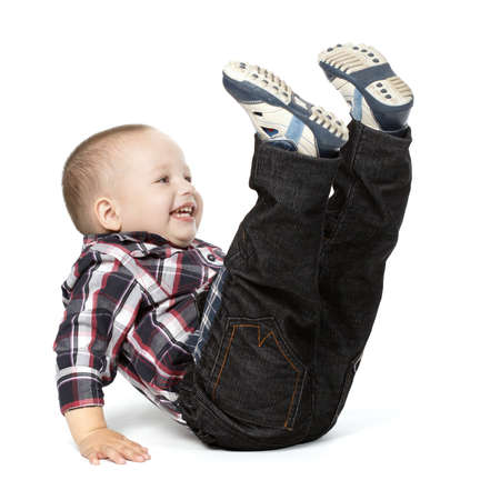 photo of little boy with legs up