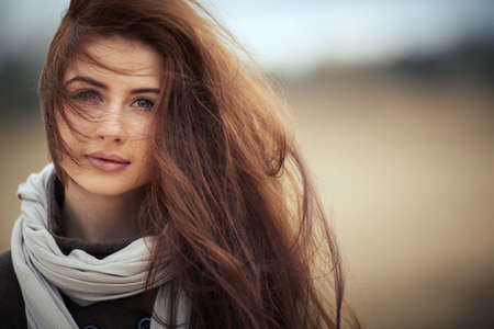 Photo of young beautiful girl with long hair