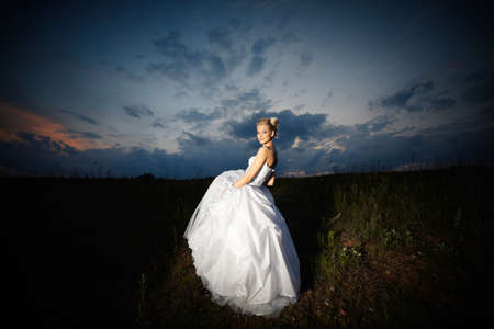 portrait of beautiful young blonde bride outdoorsの写真素材