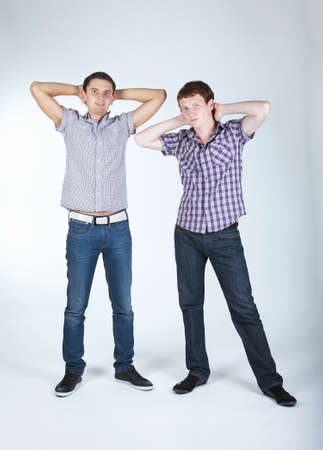 photo of two funny boys on bright backgroundの写真素材