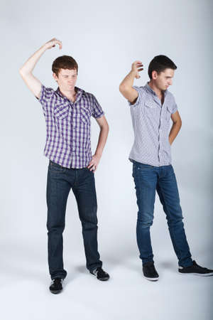 photo of two funny boys fooling aroundの写真素材