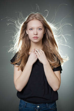 beautiful teen girl portrait with windy hairの写真素材
