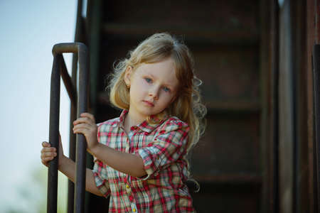 little beautiful girl with long hair posingの写真素材