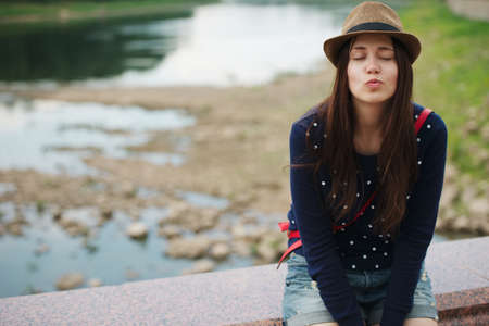 photo of young beautiful girl with hatの写真素材