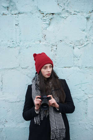 photo of young beautiful girl with red hatの写真素材