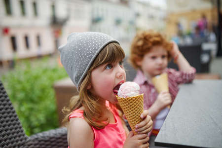 photo of two cute hipsters eating icecream