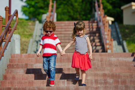 boy and girl walking on the stairway