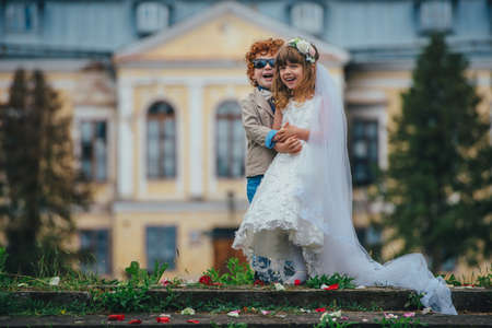 photo of two funny little bride and groomの写真素材