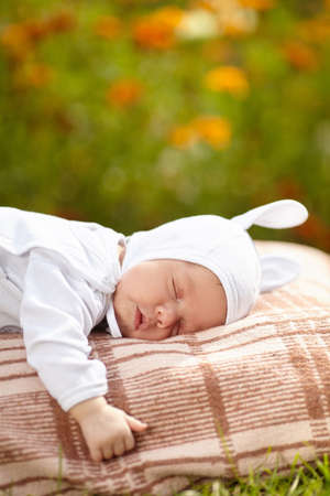 sweet sleeping baby with rabbit costume portraitの写真素材