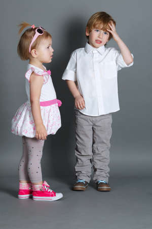 photo of little funny boy ignoring girlの写真素材