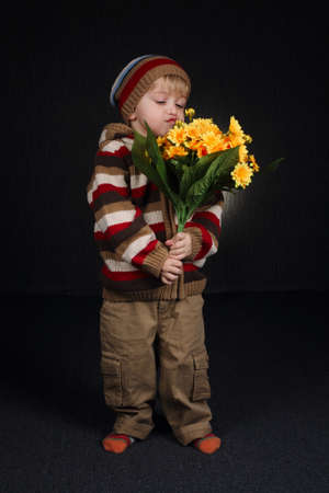 photo of little sweet boy with flowers