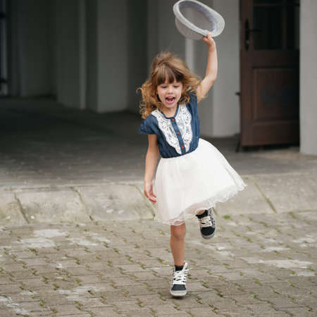 photo of young happy girl running awayの写真素材
