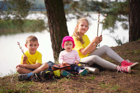 photo of happy children hiking in the forestの写真素材