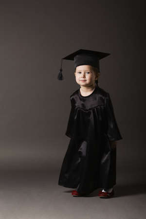 photo of diploma graduating little student kidの写真素材