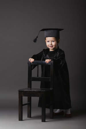 photo of diploma graduating little student kidの写真素材