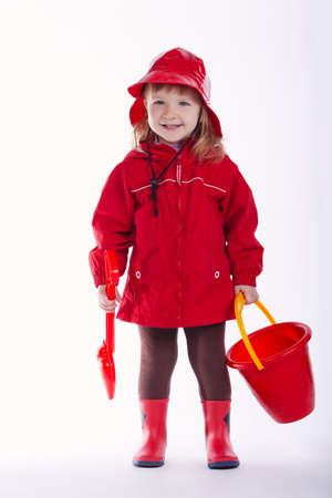 photo of little funny firefighter on white backgroundの写真素材