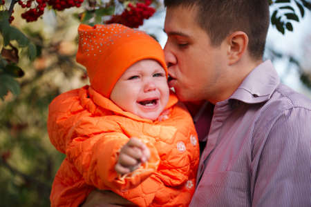 photo of caring father with little daughter