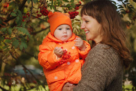 photo of happy mother showing daughter rowanの写真素材