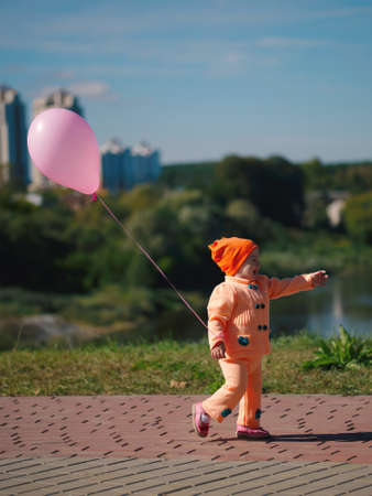 photo of little sad girl with balloonの写真素材