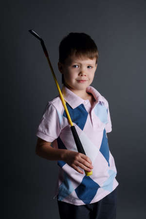 photo of little boy playing mini golfの写真素材