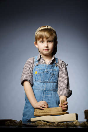 photo of little boy working with planeの写真素材