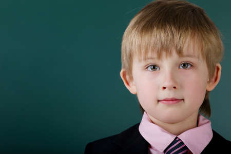 photo of little funny boy with blackboardの写真素材