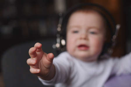 photo of little boy using headphones with micの写真素材