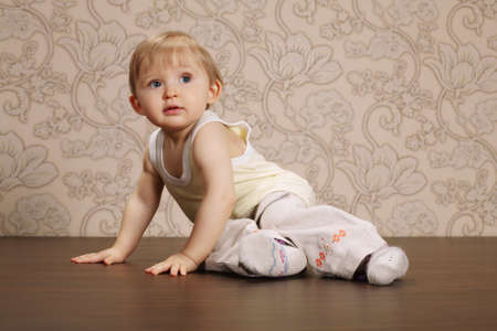 beautiful funny child sitting on floor