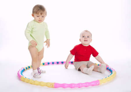 beautiful funny children playing with hoopの写真素材