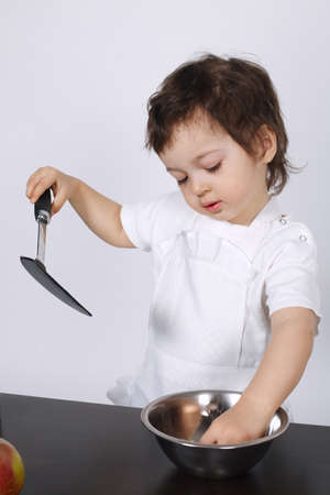 brothers making cake in the kitchenの写真素材