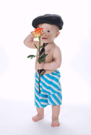 little funny boy with rose on whiteの写真素材