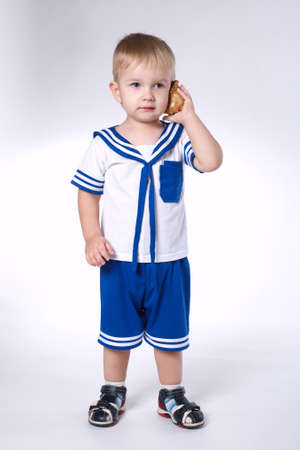 Listen to the sea isolated on whiteの写真素材