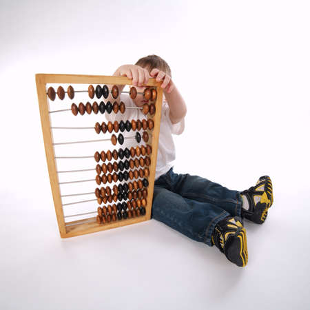 boy with abacus isolated on whiteの写真素材