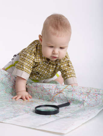baby planning travel with map on whiteの写真素材