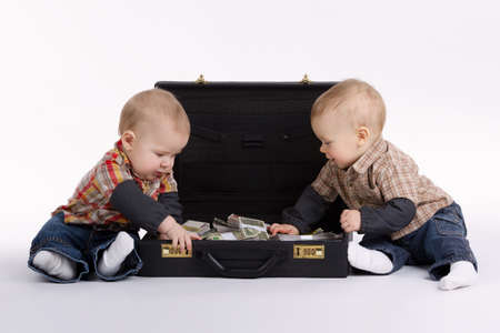 young bookkeepers with suitcase of moneyの写真素材