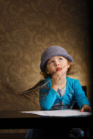 little beautiful vintage writer girlの写真素材