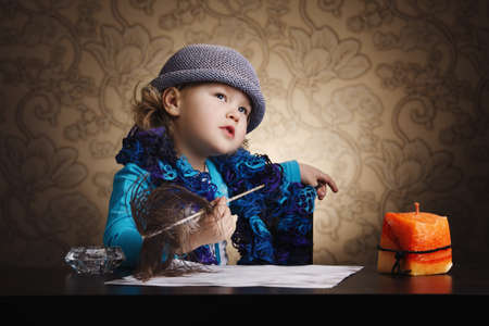 little beautiful vintage writer girlの写真素材