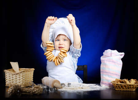 young funny cook with kitchenwareの写真素材