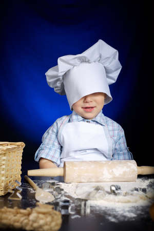 young funny cook with kitchenwareの写真素材