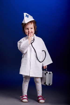 little girl with doctors uniformの写真素材