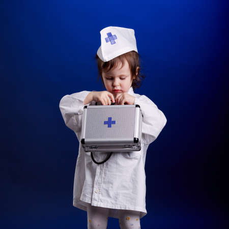 little girl with doctors uniformの写真素材