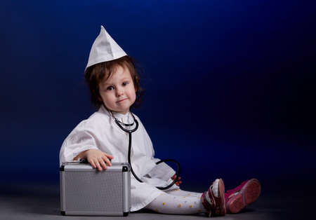 little girl with doctors uniformの写真素材