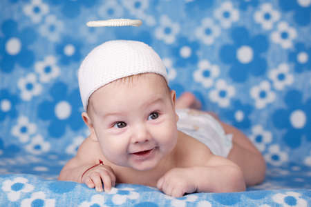 cute angel baby on blue backgroundの写真素材