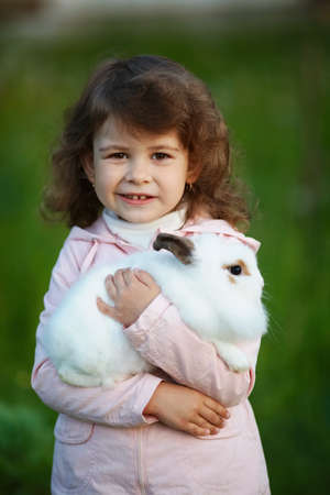 cute little girl with white rabbitの写真素材