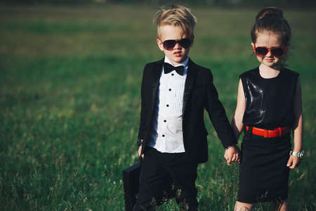 young boy and girl playing spyの写真素材